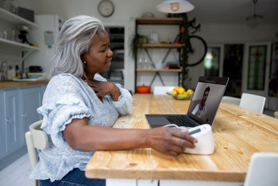 woman talking to a health care provider online